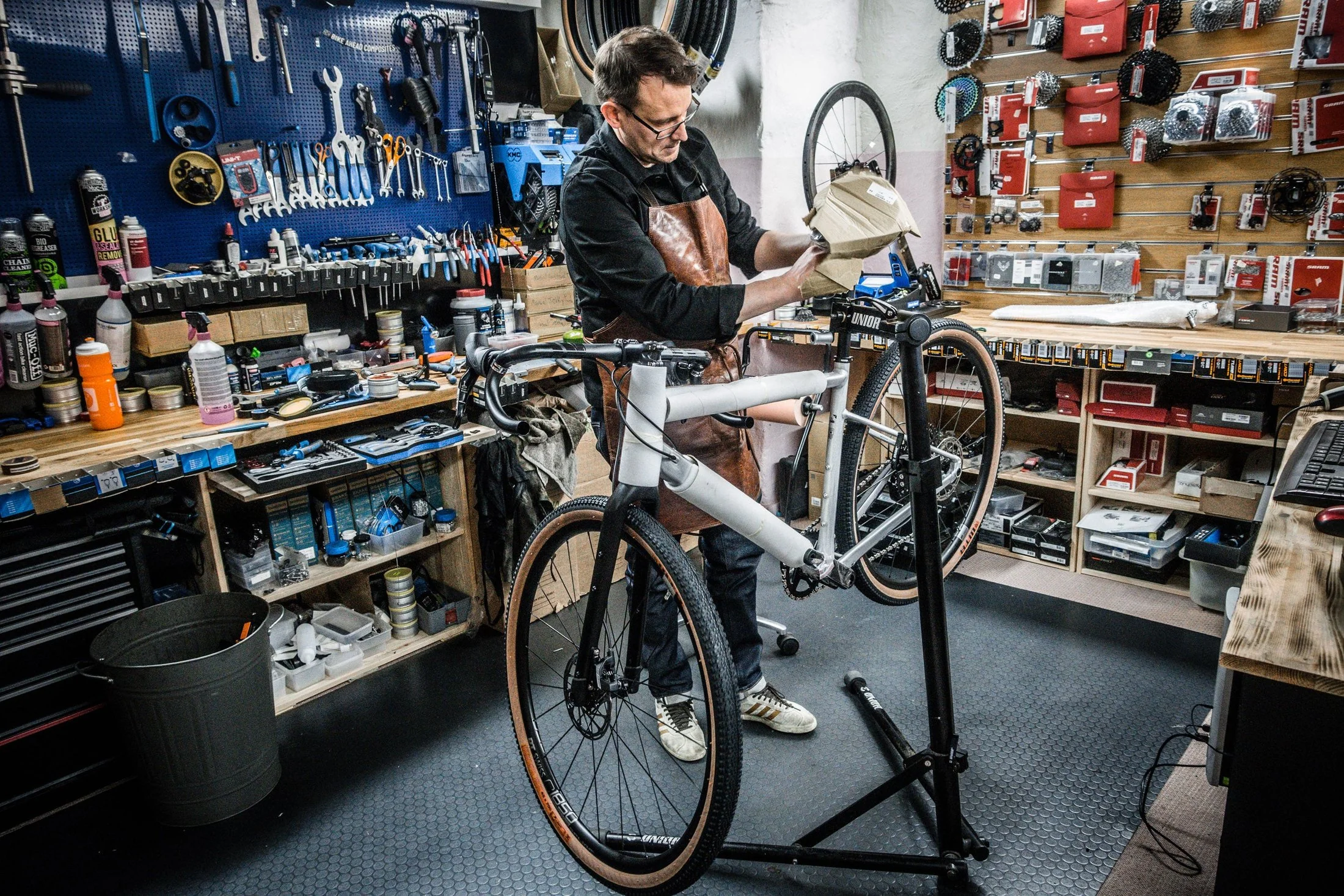Bicycle repair tools and replacement components prepared for a maintenance appointment