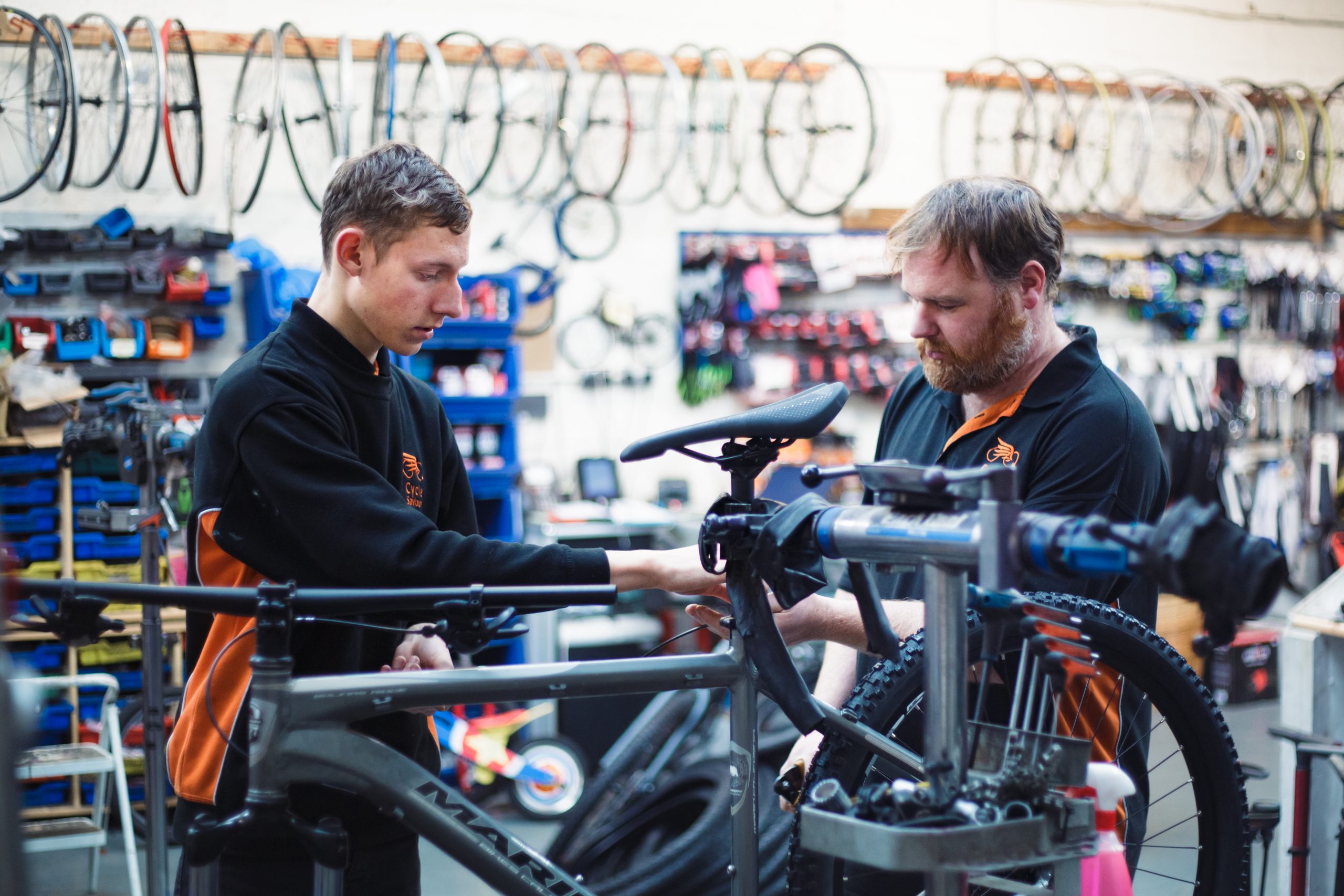 Bicycle repair tools and replacement components prepared for a professional workshop service